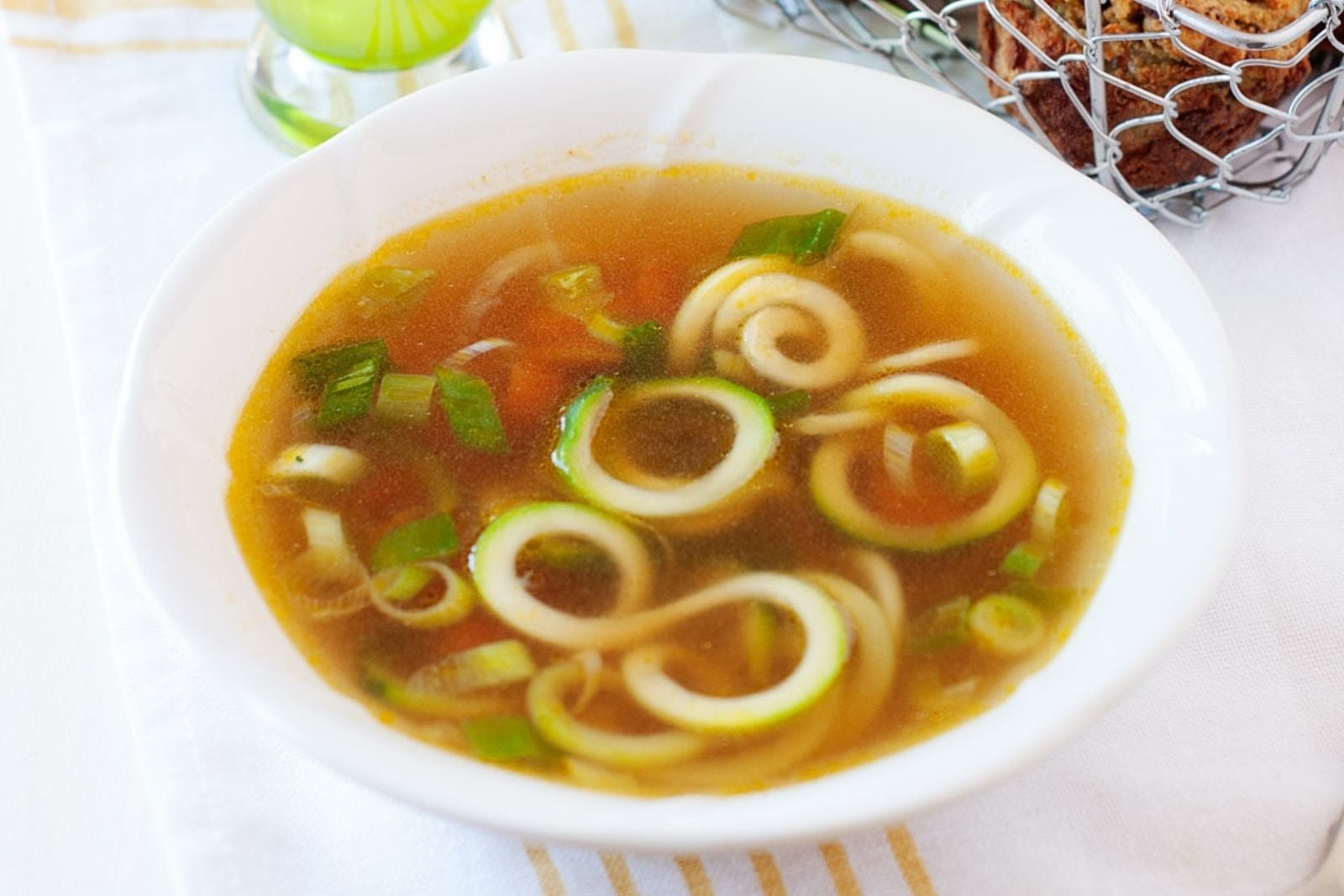 a bowl with zucchini ramen soup