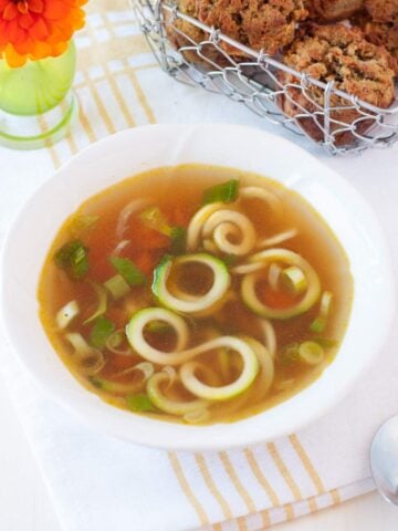 a bowl with zucchini ramen soup