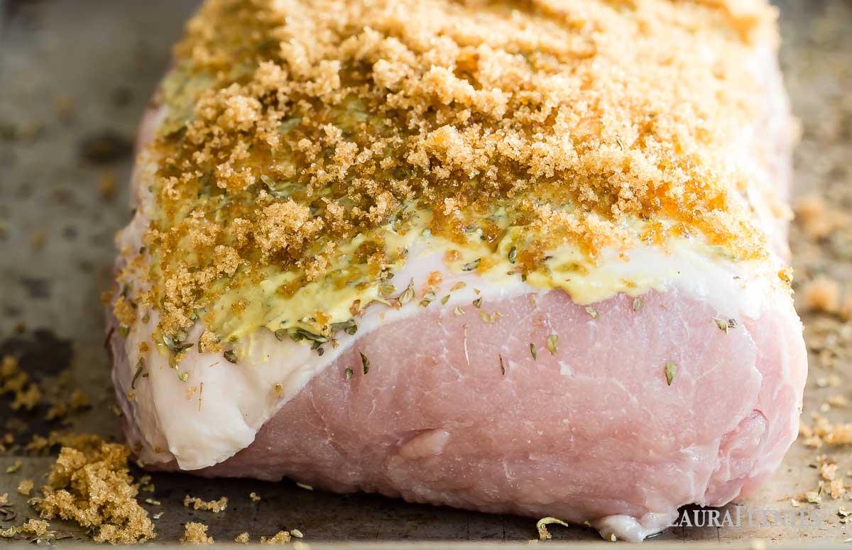 brown sugar and dijon pork loin roast on a baking tray before cooking