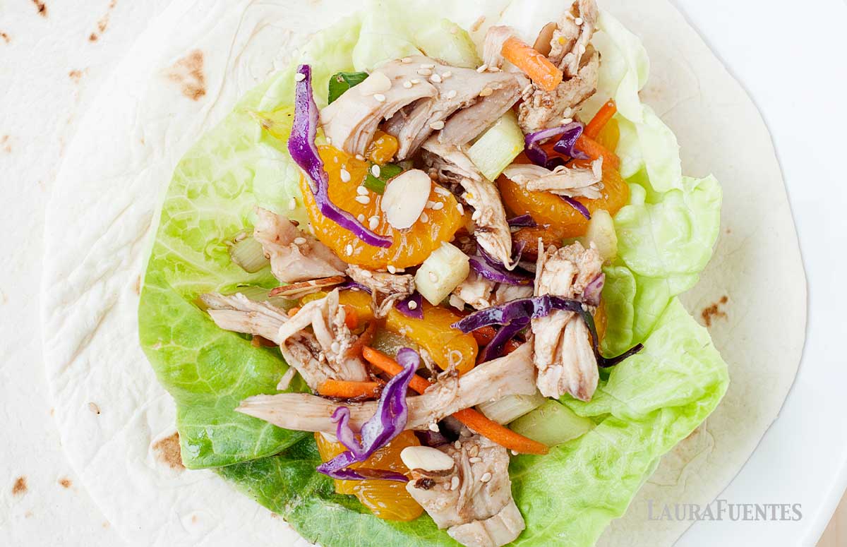 Asian Chicken Salad on a lettuce cup over tortillas