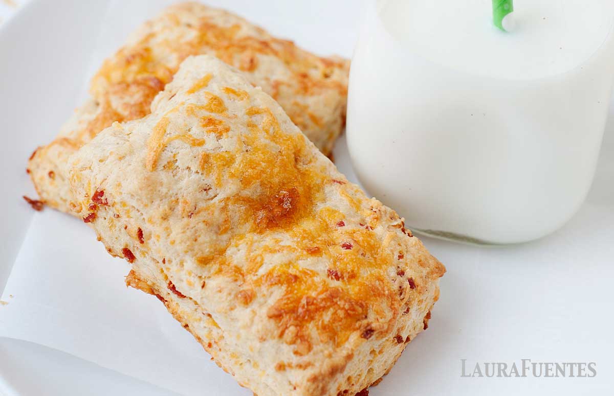 cheesy pepperoni stuffed pizza biscuits on a white plate