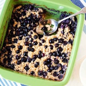 overhead view of baked blueberry oatmeal in a baking dish