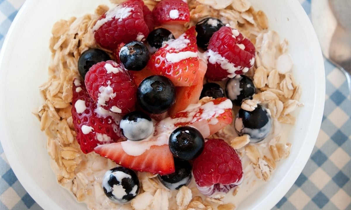 a bowl of cold oatmeal with berries