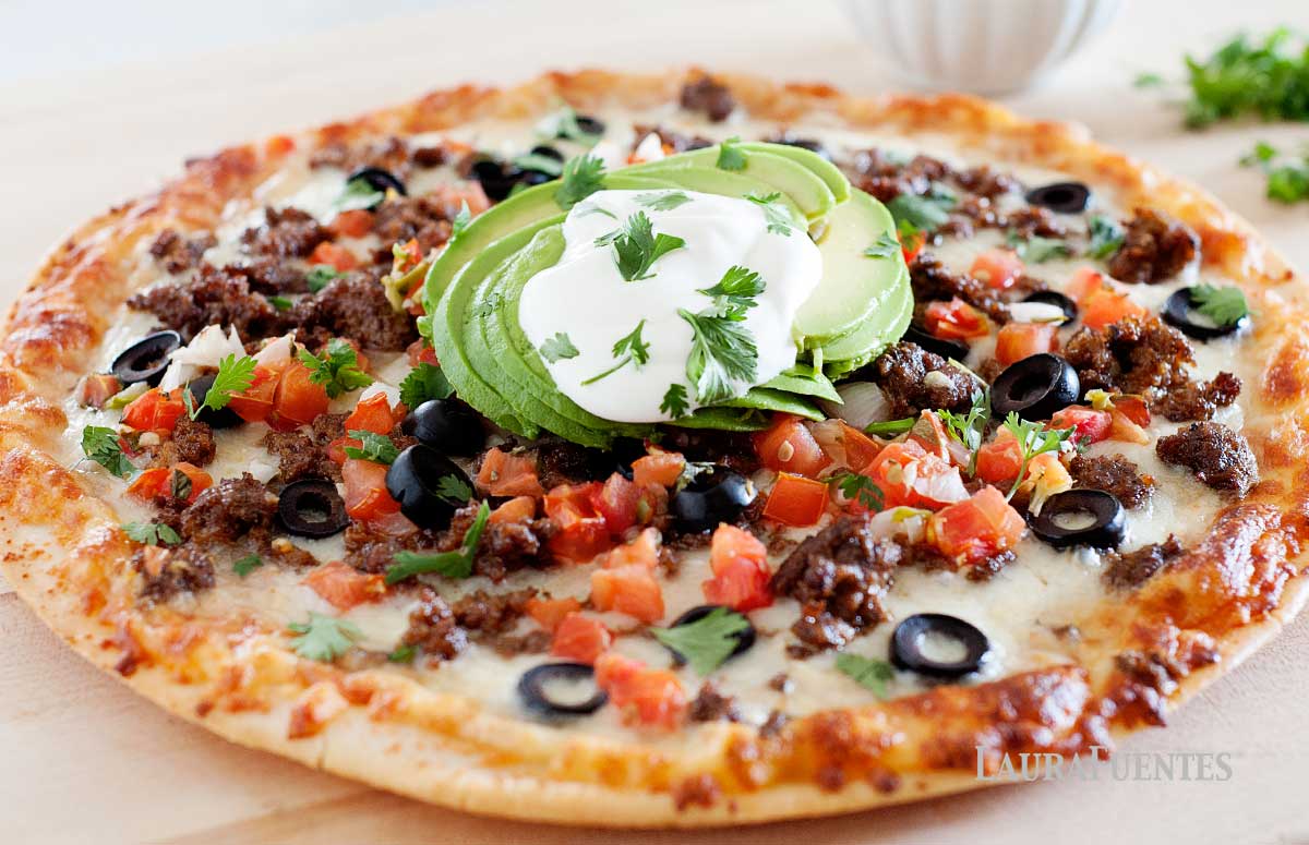 taco pizza with avocado on top