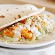 slow cooker buffalo chicken tacos on a plate