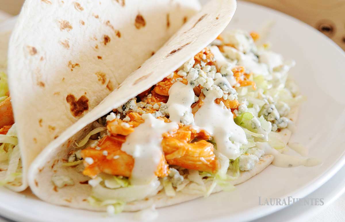 slow cooker buffalo chicken tacos on a plate