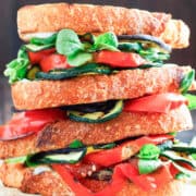 two grilled vegetable sandwiches on top of each other