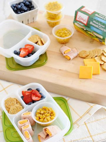 Healthy bento boxes with protein, cheese, and veggies for back to school