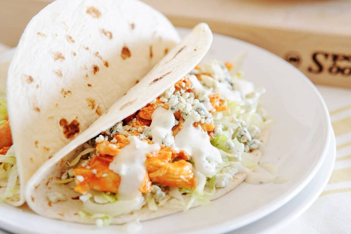 slow cooker buffalo chicken tacos on a plate