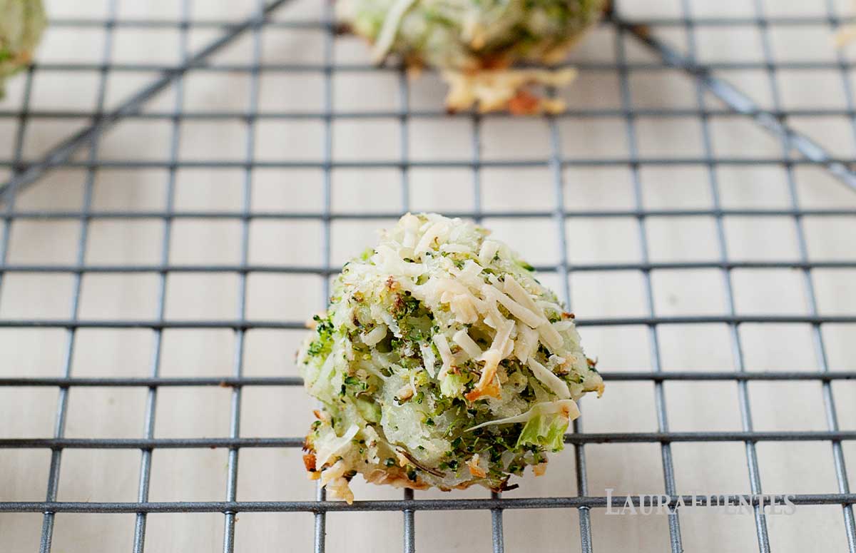 closeup of cheesy broccoli tots on a cooling rack