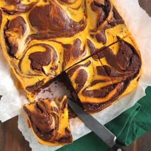 pumpkin swirl brownies being cut into large pieces