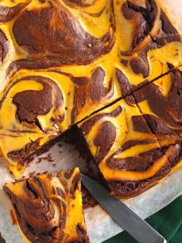overhead view of a piece of pumpkin brownie being sliced
