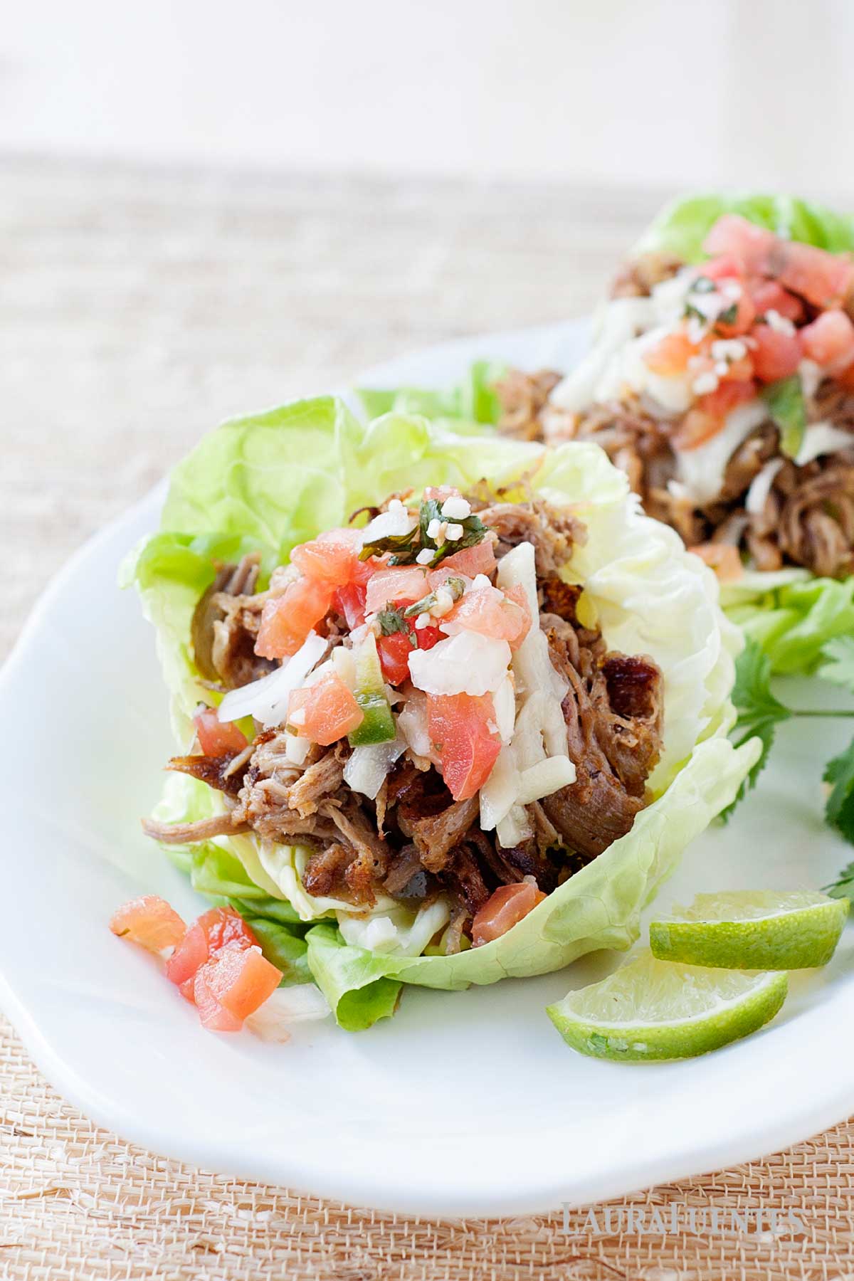 pork lettuce wraps on a white plate