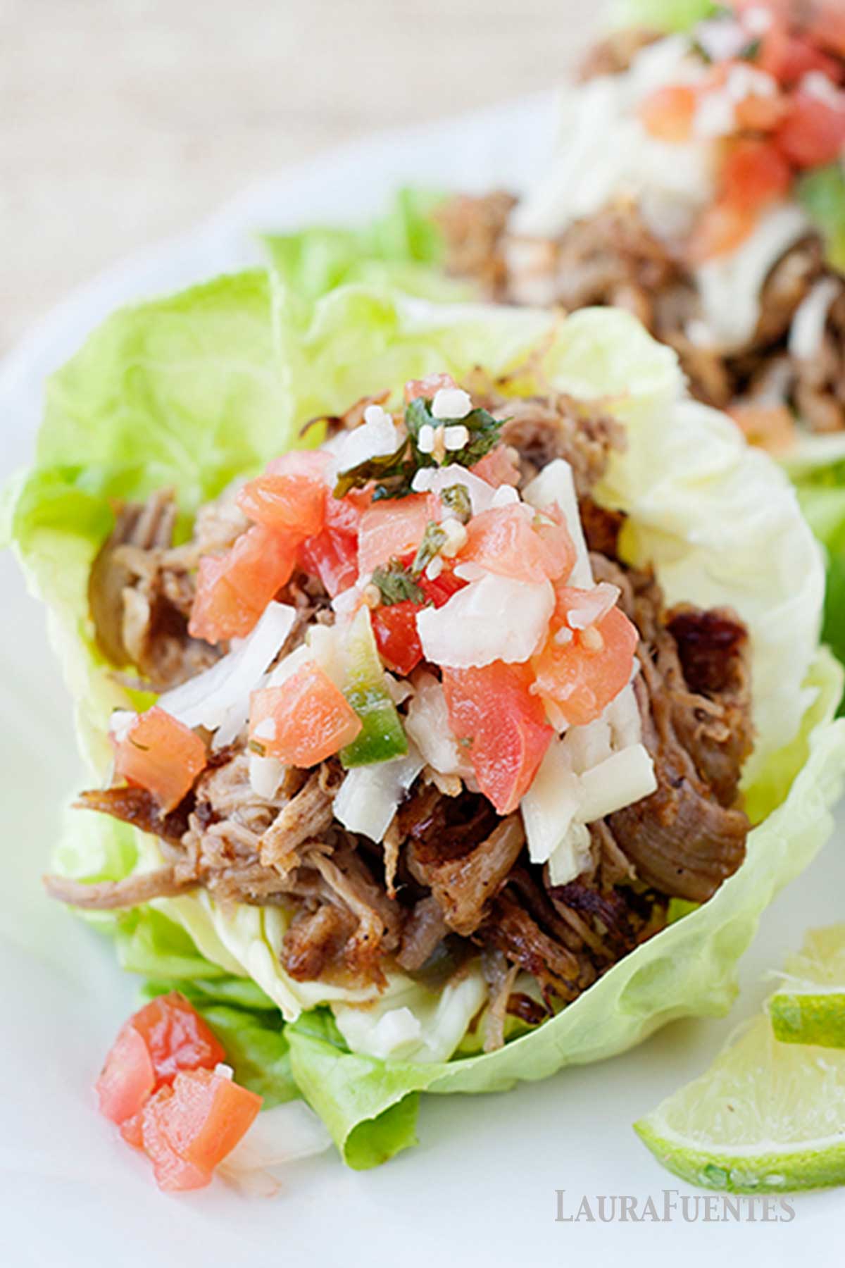 carnita lettuce cups on a white plate
