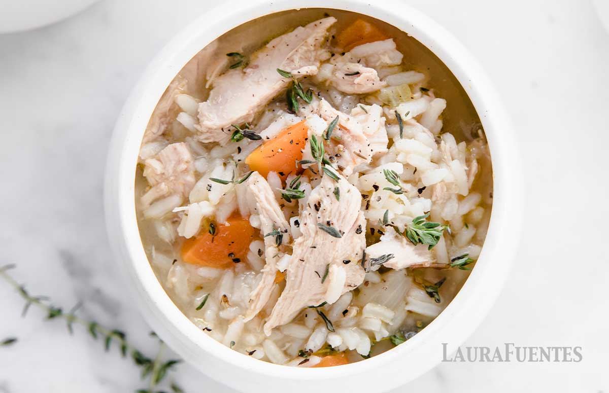 overhead view of a bowl of chicken and rice soup