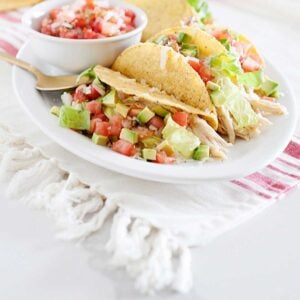 Slow Cooker Salsa Verde Chicken Tacos on a white plate