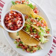 salsa verde chicken tacos on a platter