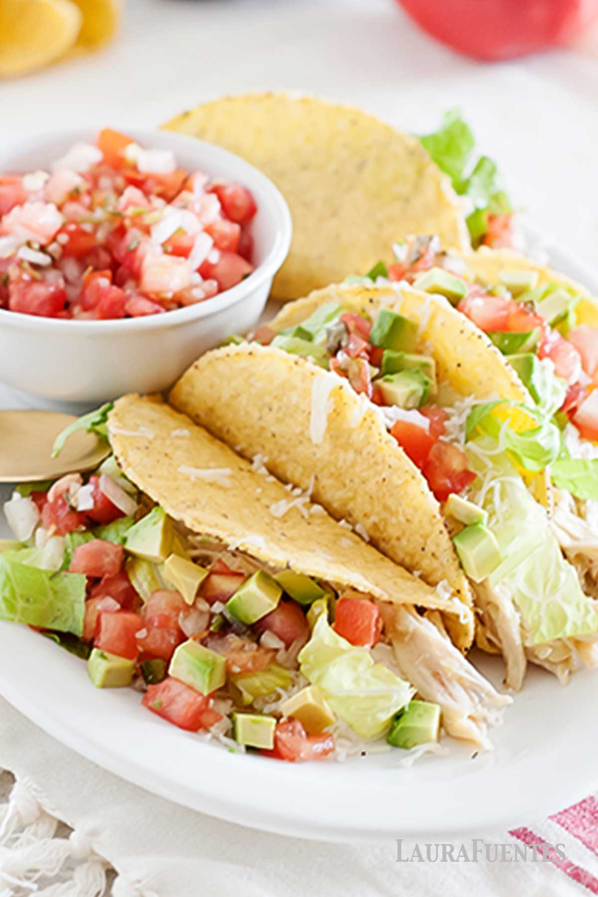 Slow Cooker Salsa Verde Chicken Tacos on a white plate