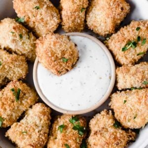 homemade salmon nuggets in a bowl with dip in the middle