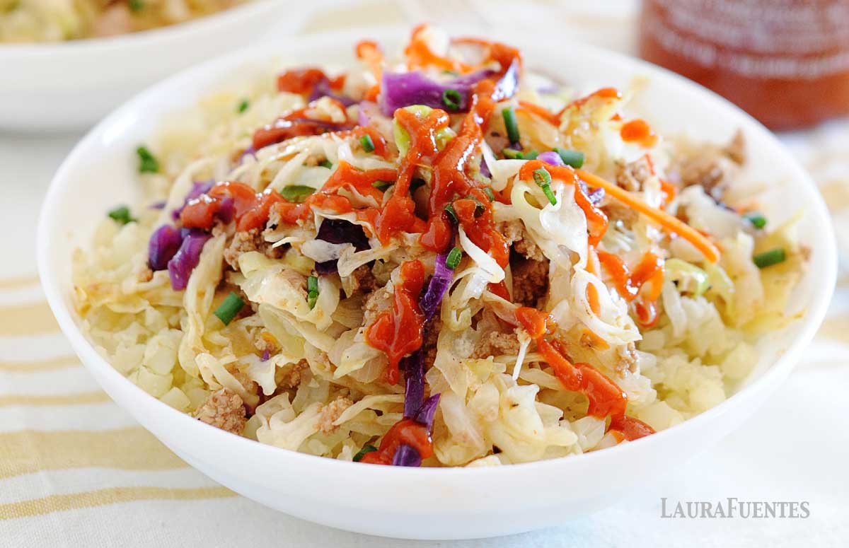 a white bowl of egg roll filling