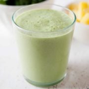 large glass of pineapple green smoothies