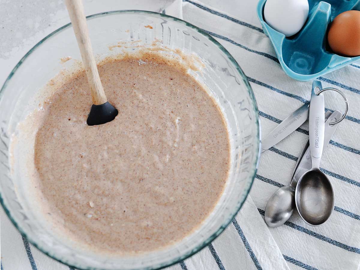 large glass bowl of cinnamon pancake batter