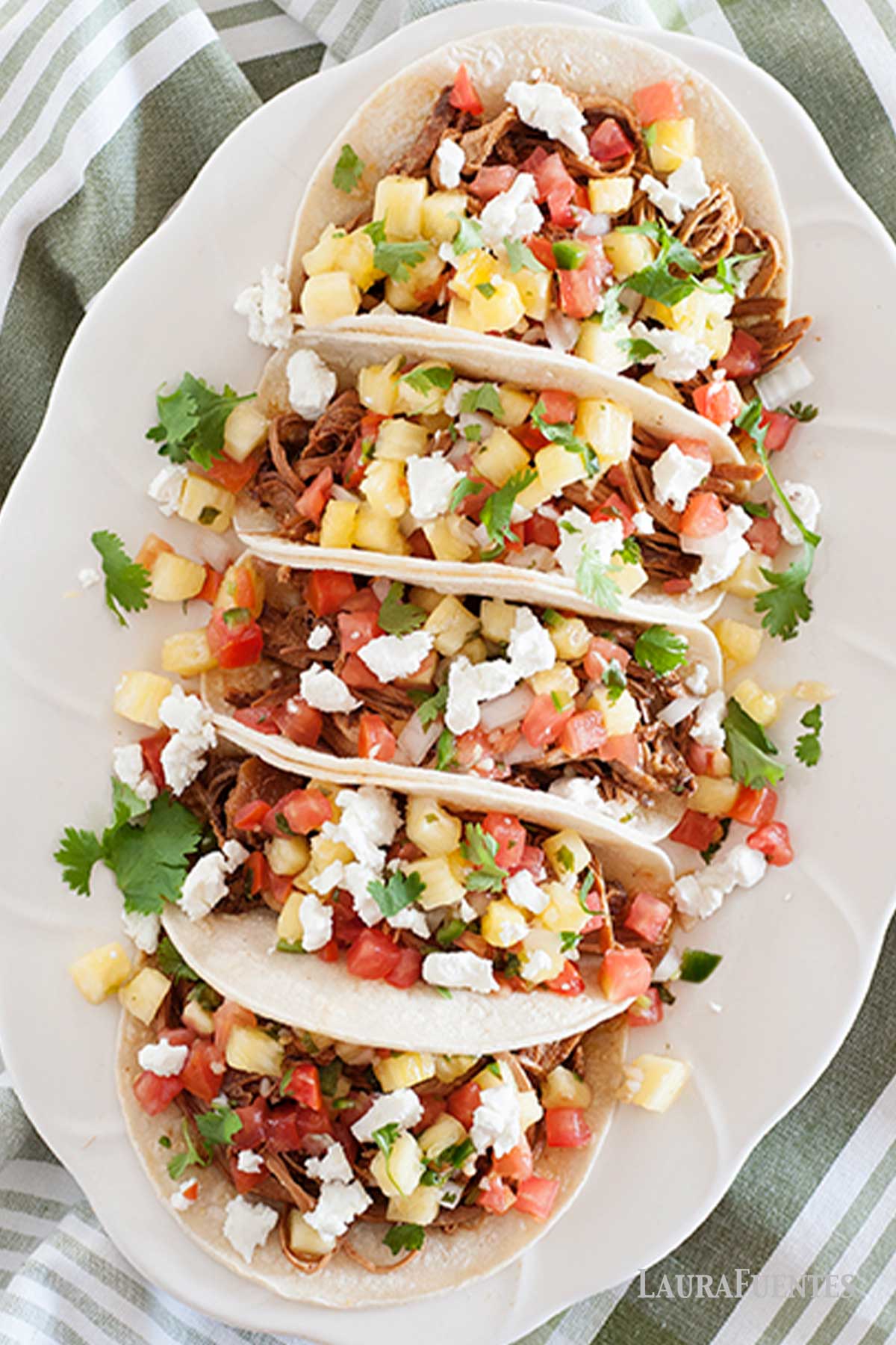 overhead view of pulled pork tacos on a plate