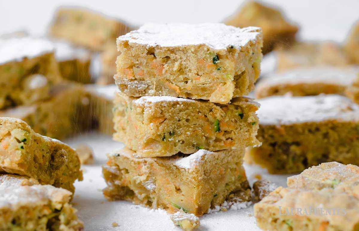 zucchini cake bars being sprinkled with sugar