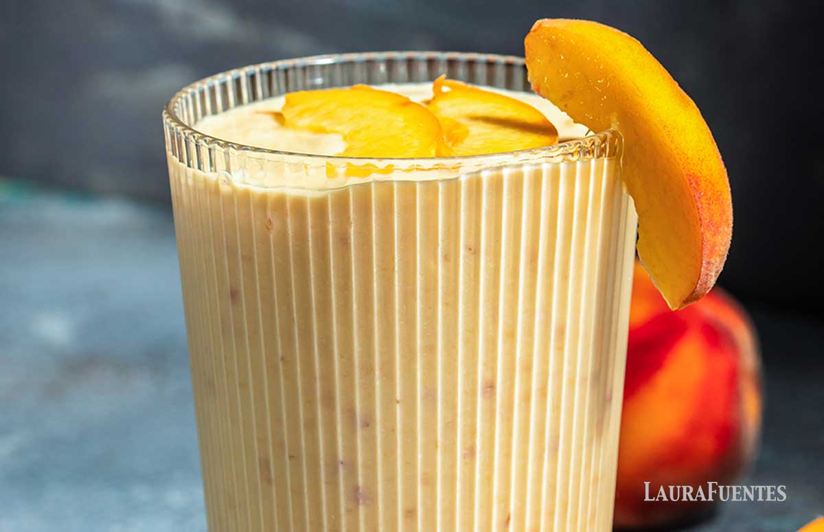 a glass of peach smoothie