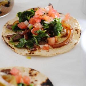 image: flat lay of steak tacos with chimichurri sauce