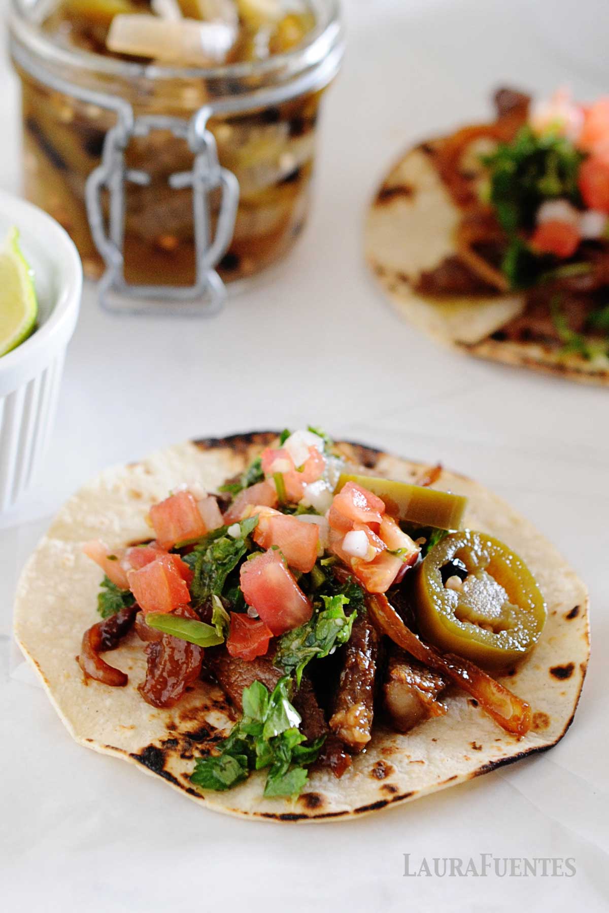 image: flat lay of steak tacos with chimichurri sauce