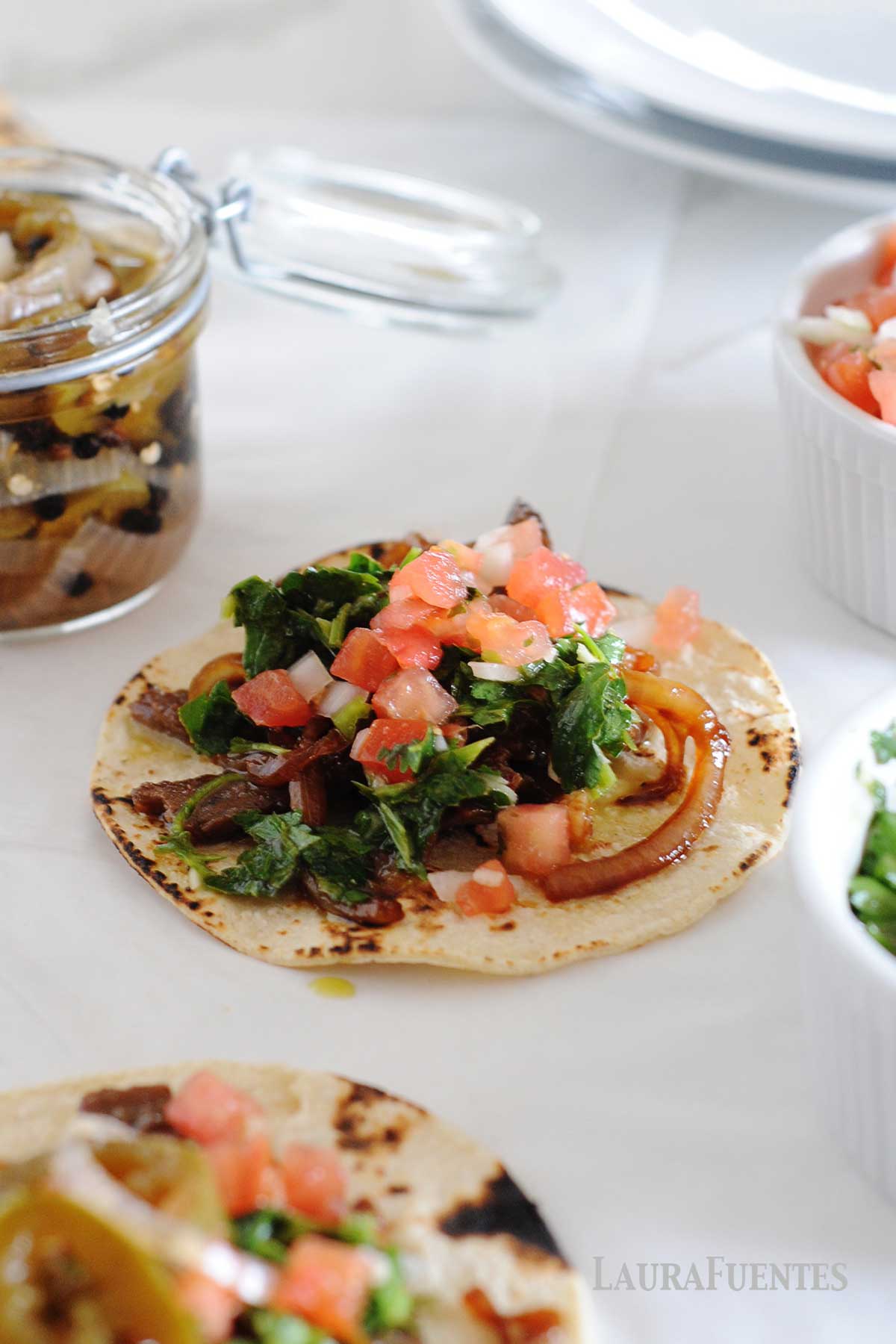 image: flat lay of steak tacos with chimichurri sauce
