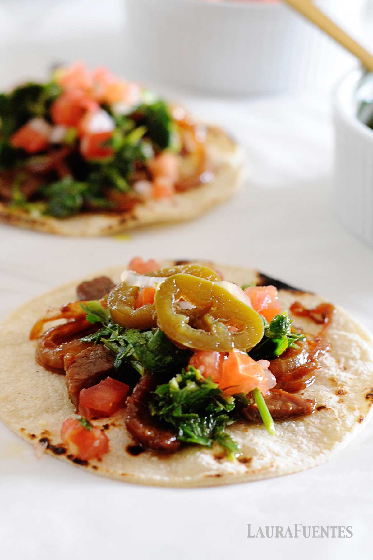 image: flat lay of steak tacos with chimichurri sauce