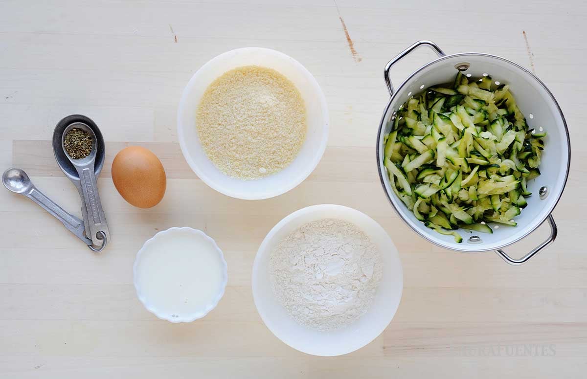 ingredients of Zucchini and Parmesan Savory Waffle: zucchini, flour, baking powder, parmesan, salt and an egg