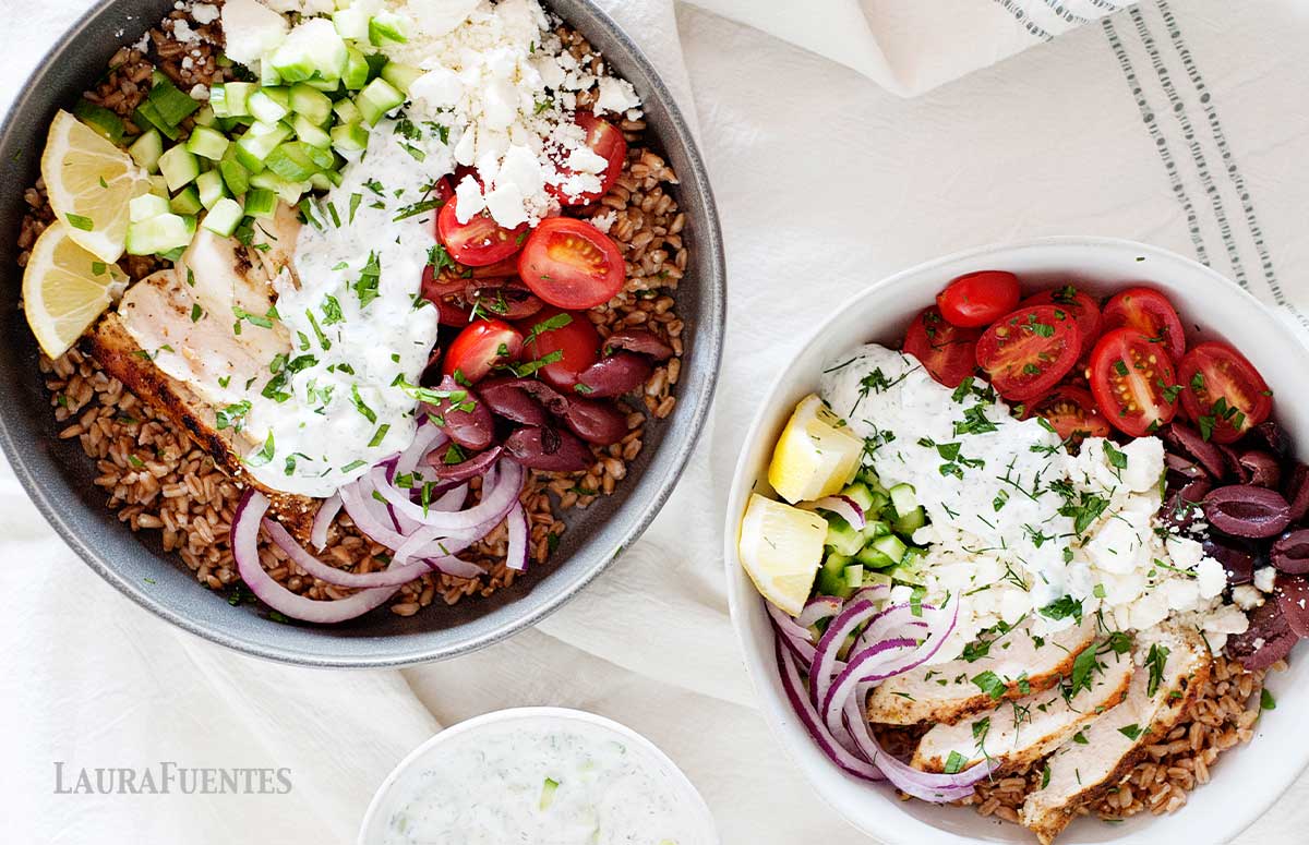 overhead view of two mediterranean chicken farro bowls