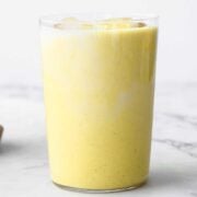 a glass of golden milk latte