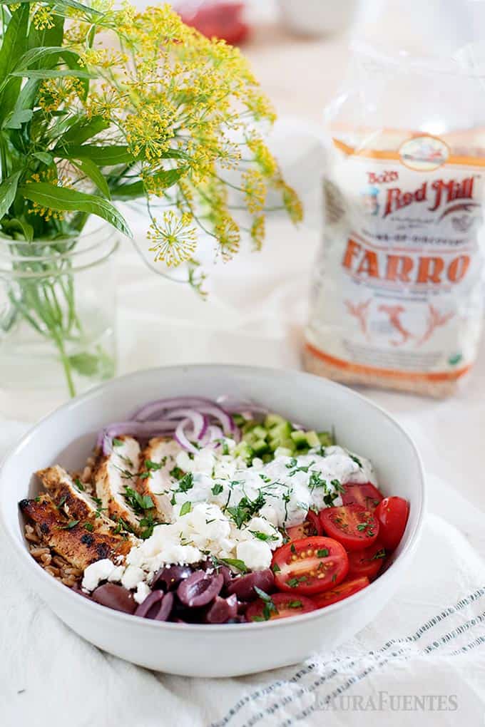 chicken farro bowl with bob's red mill bag of farro in background