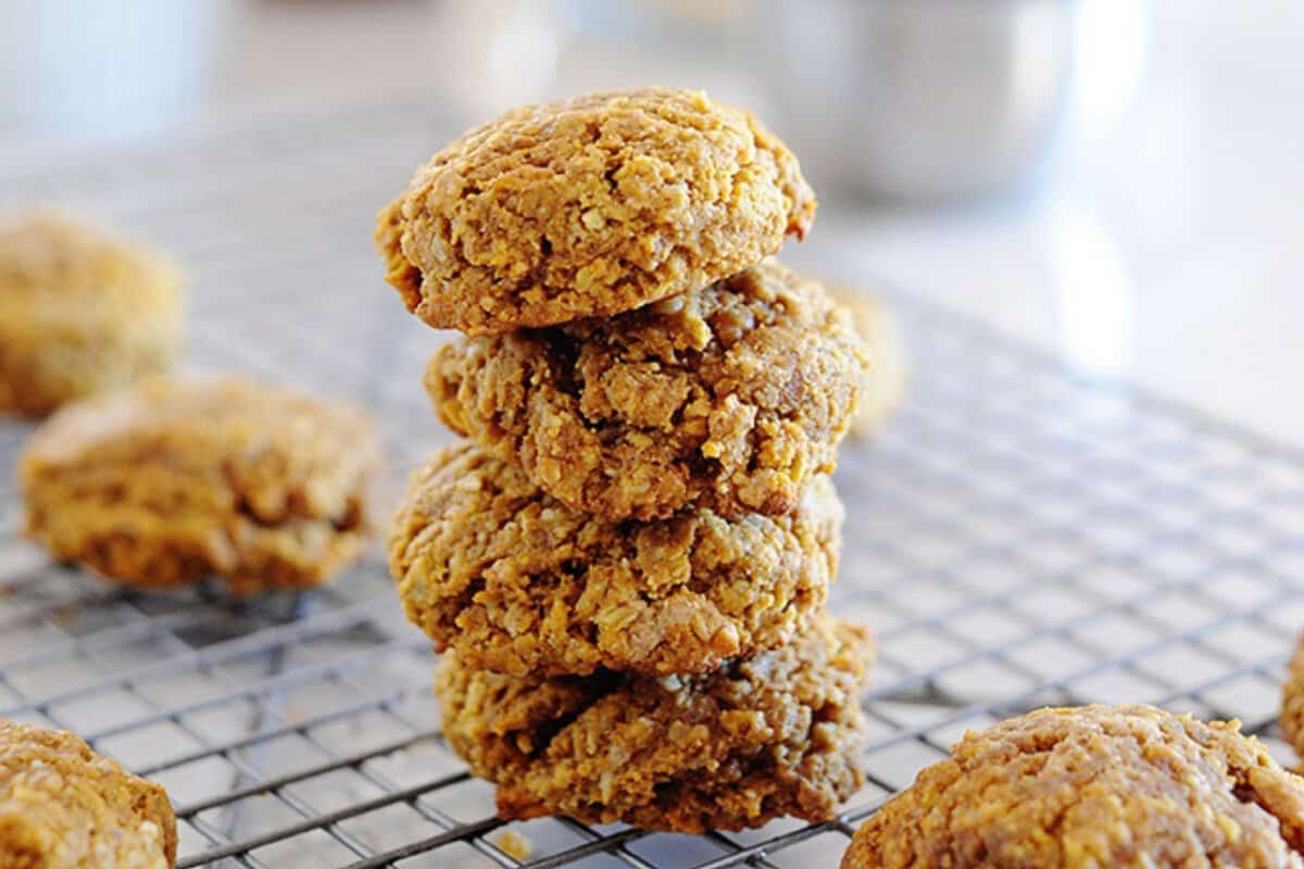 a stack of pumpkin breakfast cookies on a cooling rack