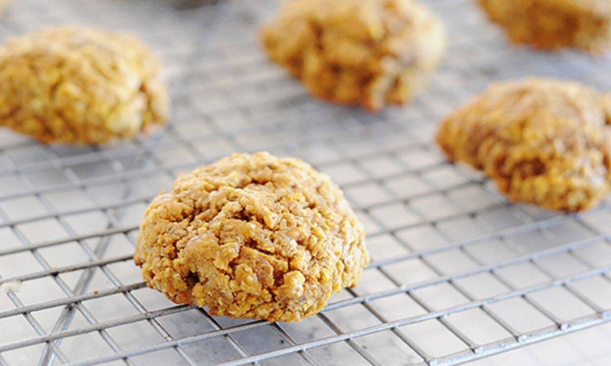 four pumpkin breakfast cookies on a cooling rack