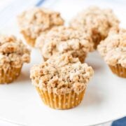 cinnamon coffee cake muffins with crumb topping on a tray
