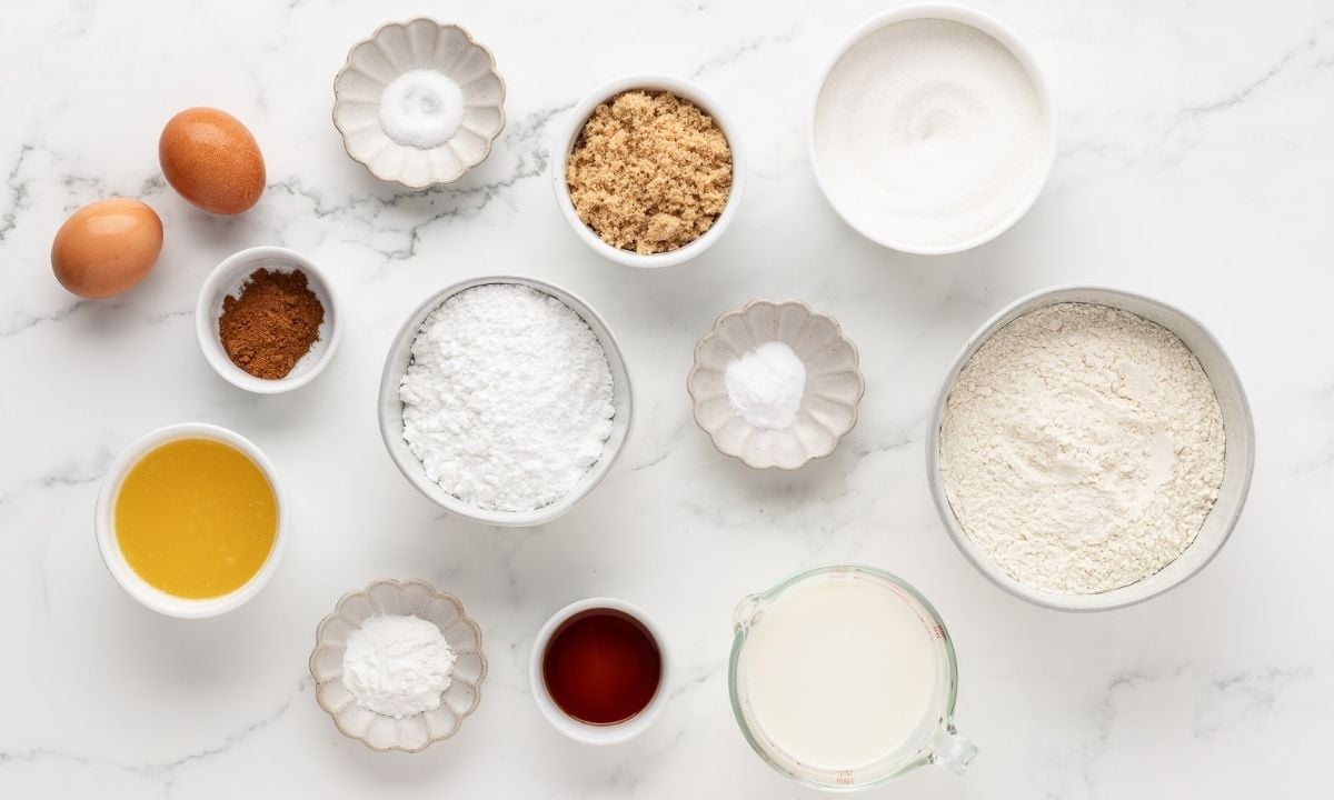 overhead view of the ingredients needed to make cinnamon coffee cake muffins with streusel topping