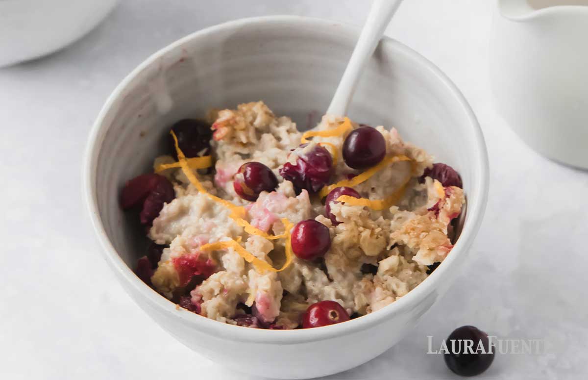 small bowl of baked oatmeal with fresh cranberries mixed in