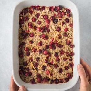 a baking dish with baked cranberry orange oatmeal