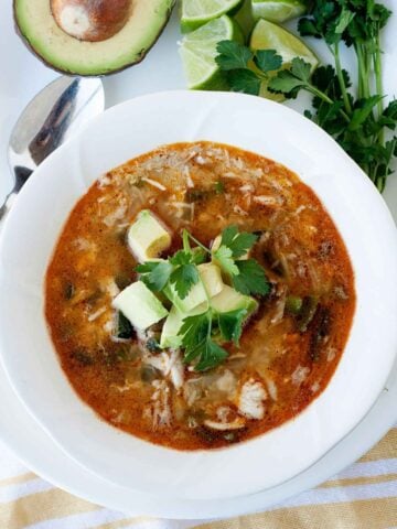 top view of a bowl of turkey chili topped with avocado