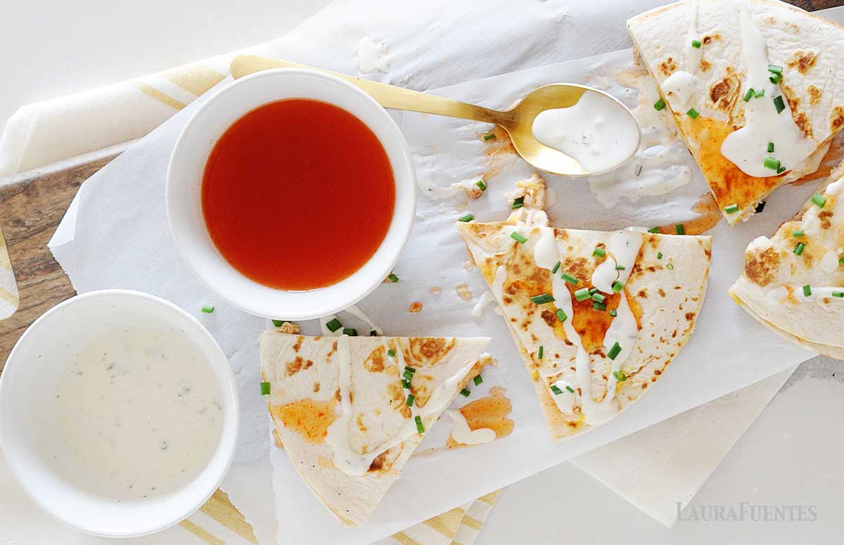 quesadillas and a little bowl with homemade buffalo sauce
