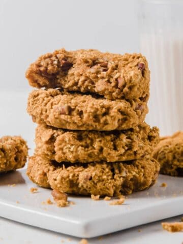 stack of four pumpkin oatmeal cookies and a few more on the back