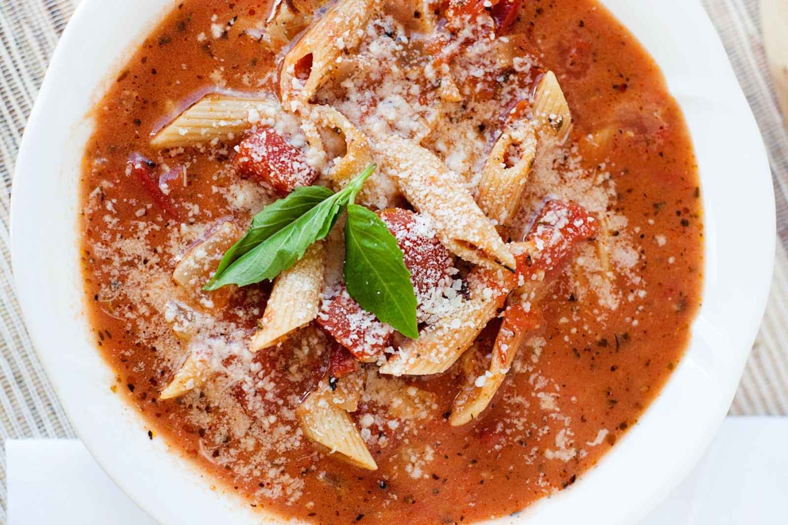 top view of a bowl of chicken parmesan soup