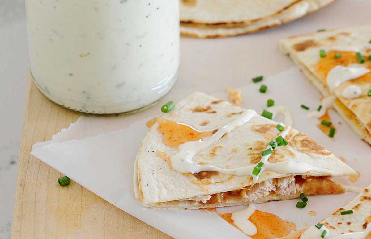 large jar of homemade ranch net to buffalo chicken quesadilla