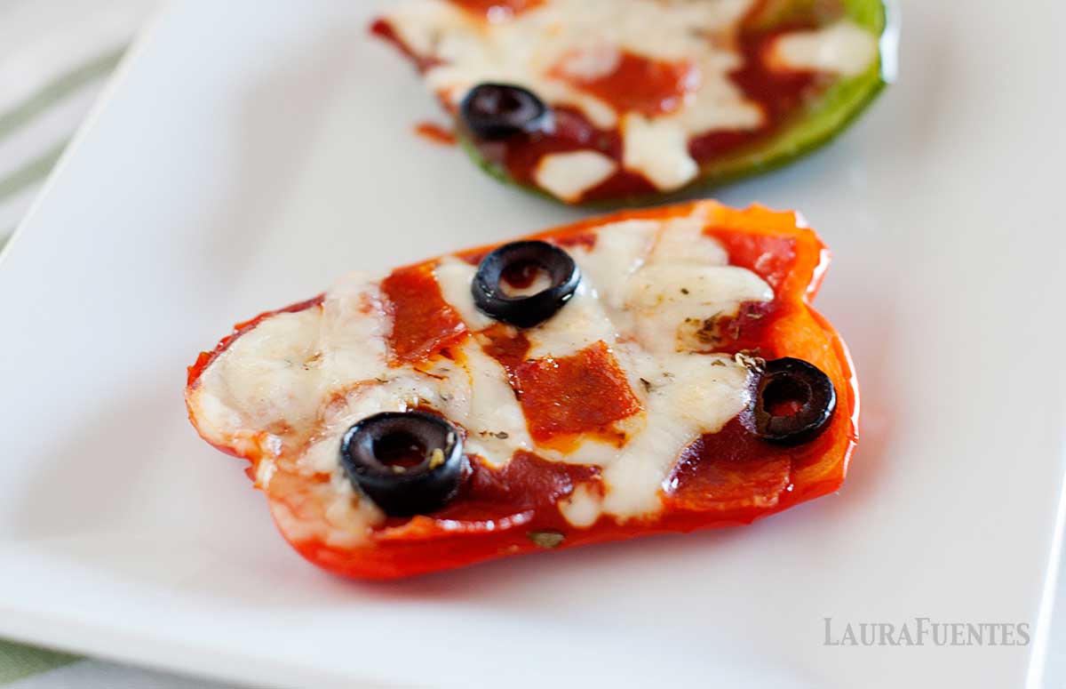 image: closeup of bell pepper pizza on a plate.