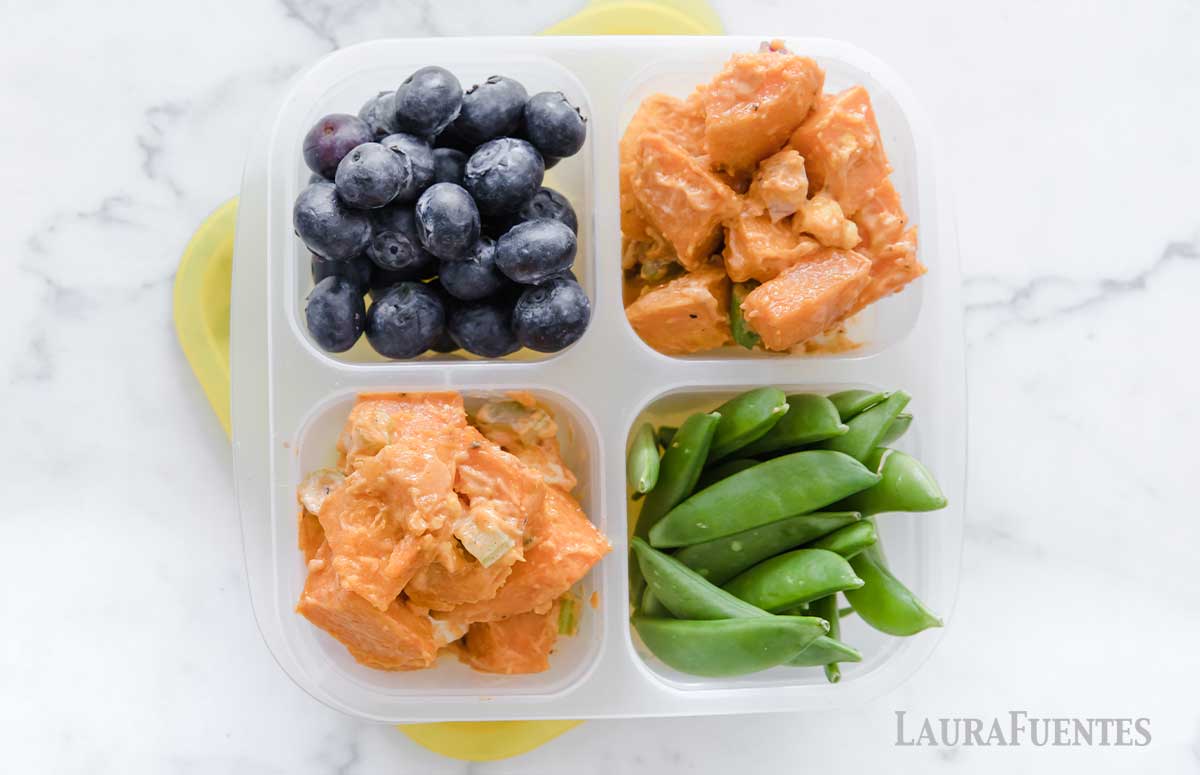 lunchbox with sweet potato salad, blueberries, and snap peas